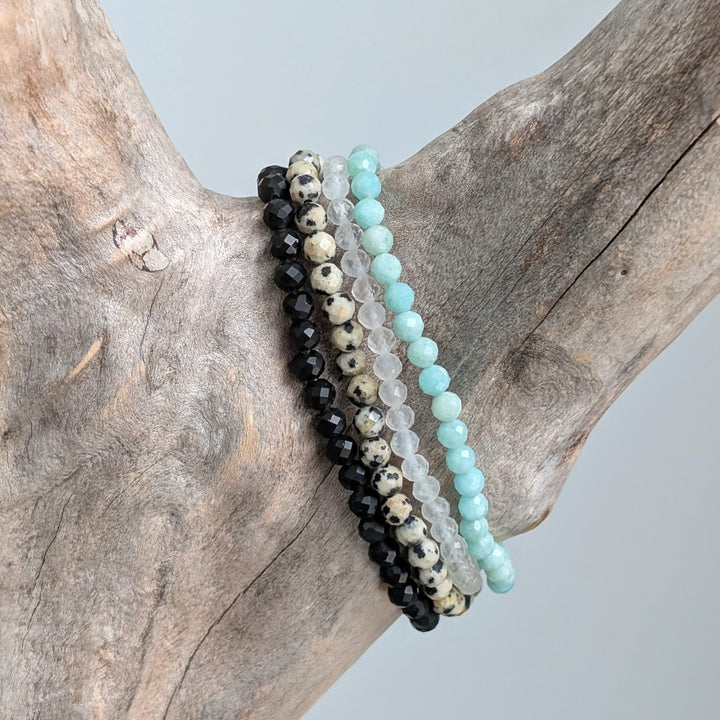 Lapis London Safe, Happy Travels and New Beginnings Gemstone Bracelet Set.  Moonstone, Amazonite, Obsidian and Dalmatian Jasper gemstone bracelets.