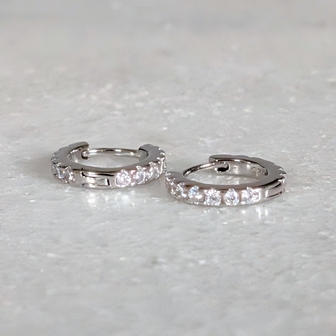 Pair of sterling silver zircon huggie hoop earrings 