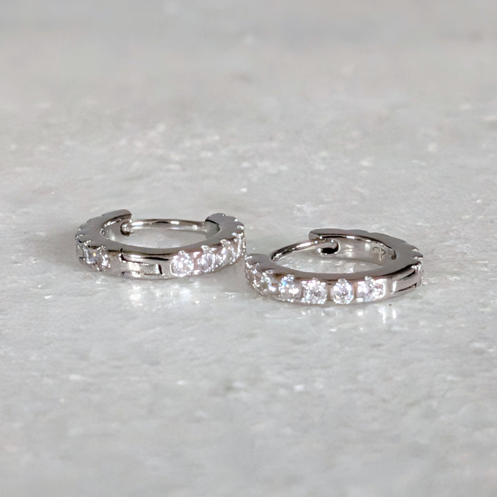 Pair of sterling silver zircon huggie hoop earrings 
