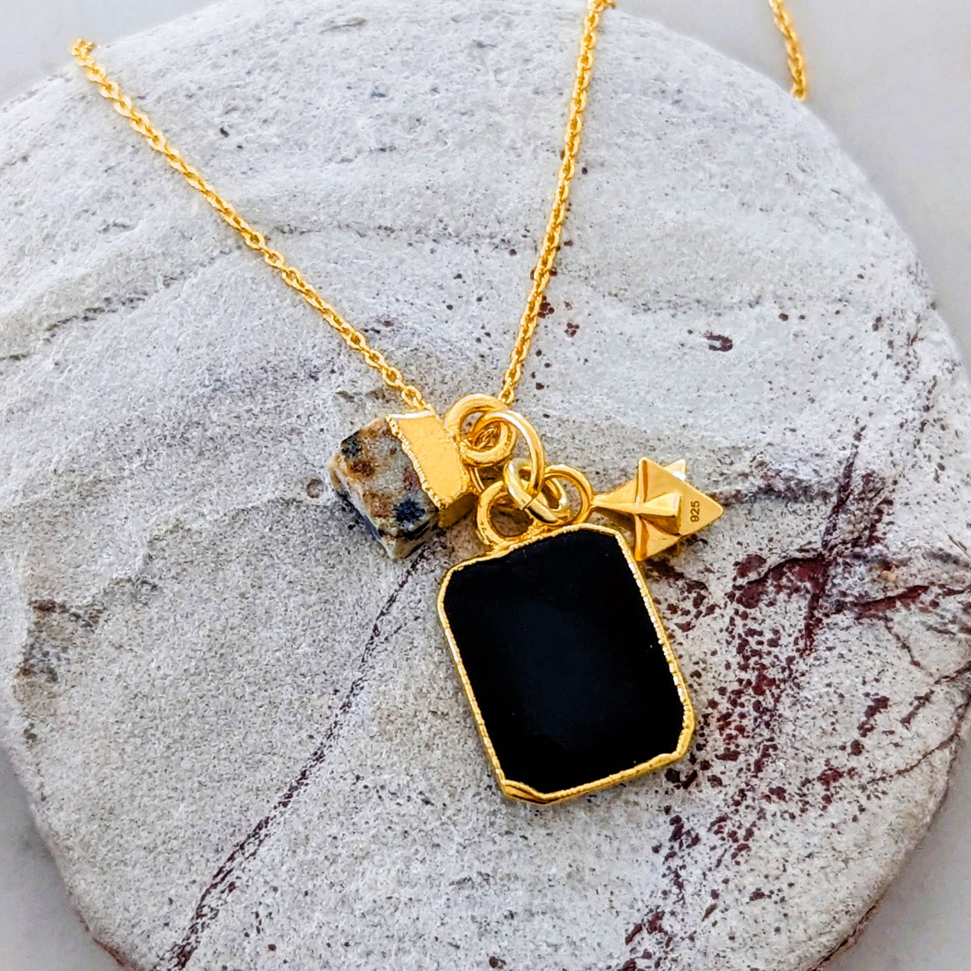 Gold plated black onyx, dalmatian jasper and tetrahedron charm pendant necklace