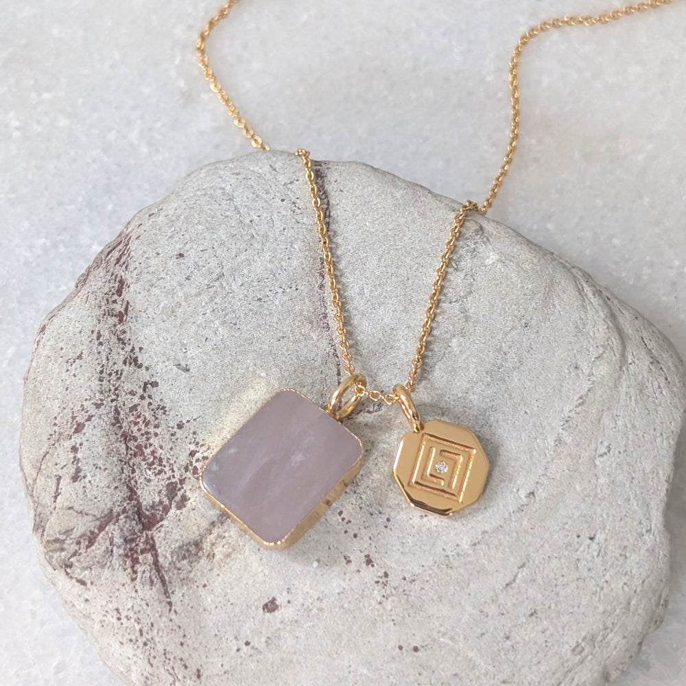 gold chain necklace with rose quartz rectangular pendant and gold disc charm