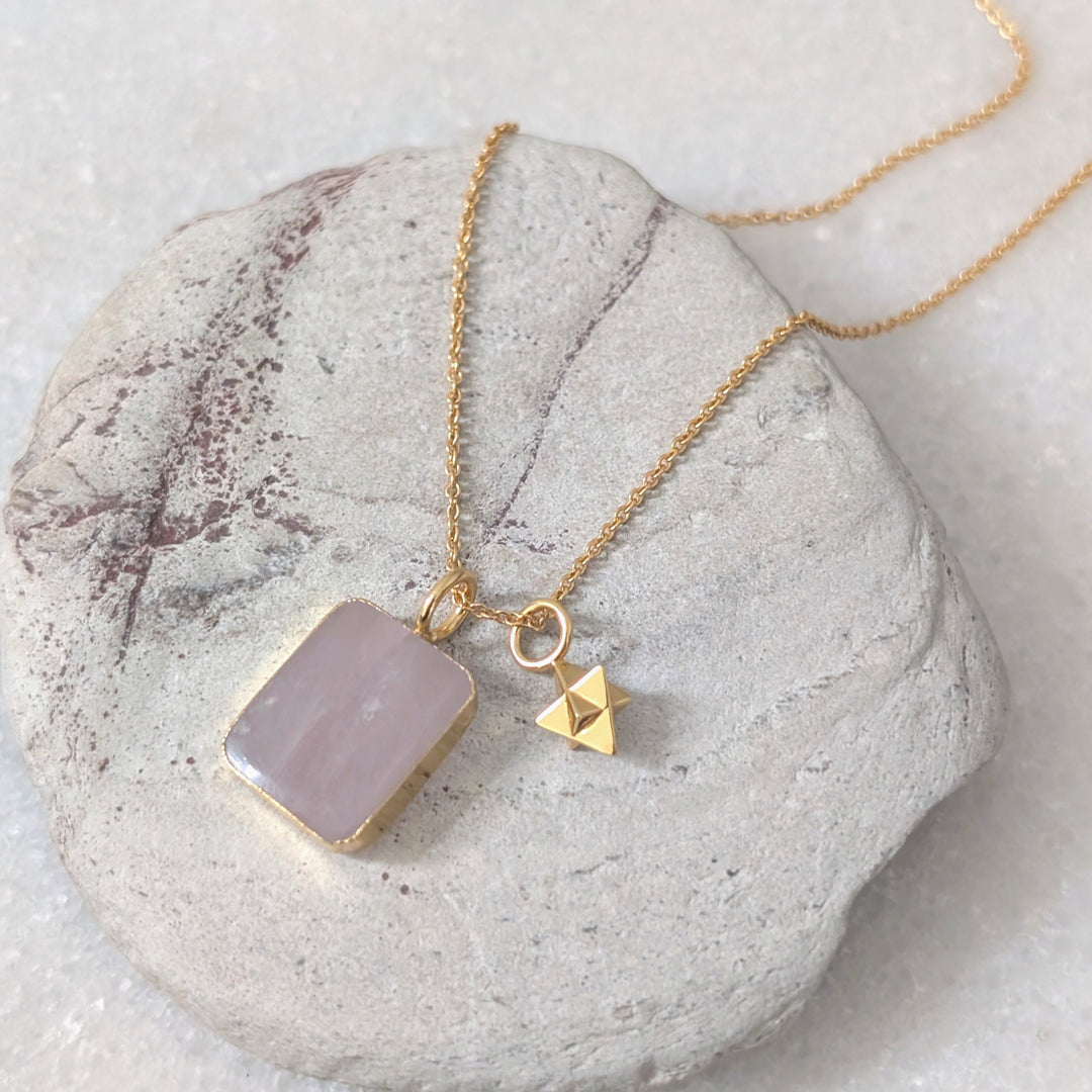gold chain necklace with rose quartz rectangular pendant and tetrahedron star charm