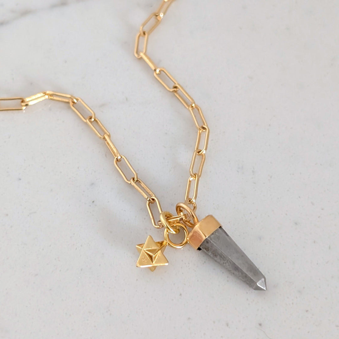 gold paperclip necklace with pyrite gemstone point pendant and tetrahedron star charm