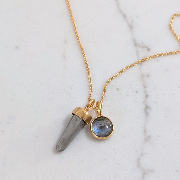 gold necklace with pyrite gemstone point pendant and labradorite charm