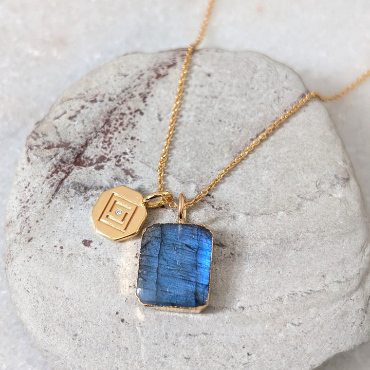 Gold necklace with a blue labradorite pendant