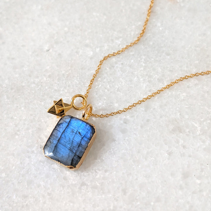 Gold necklace with a blue labradorite pendant