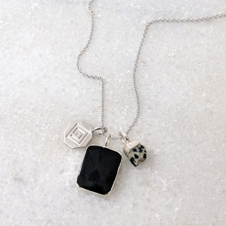 Sterling silver black tourmaline charm pendant necklace.