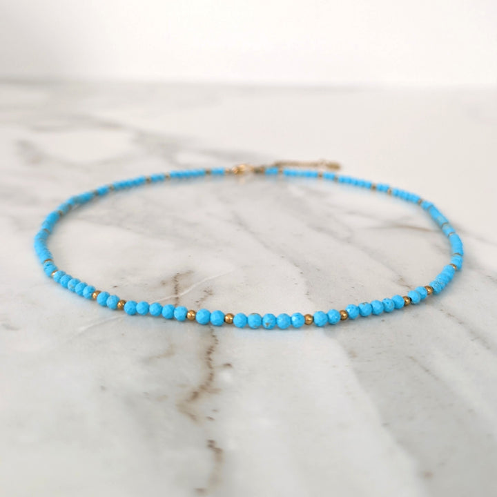 turquoise gemstone and gold bead necklace 