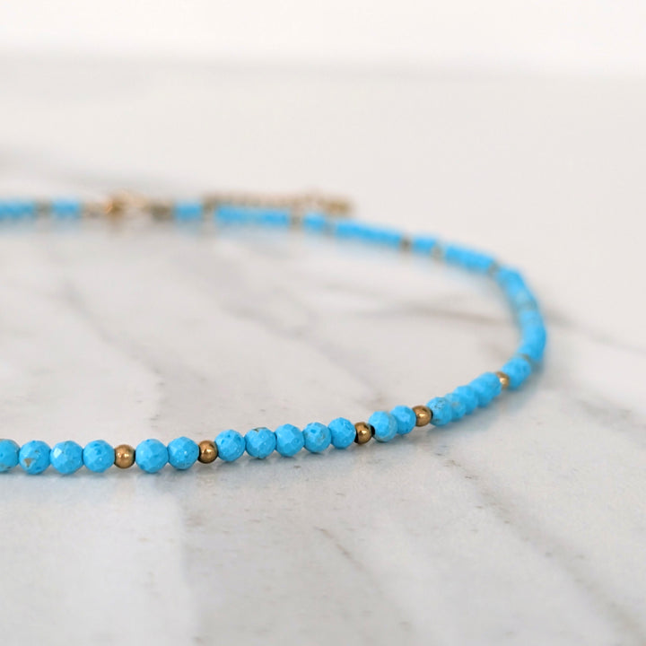 turquoise gemstone and gold bead necklace 