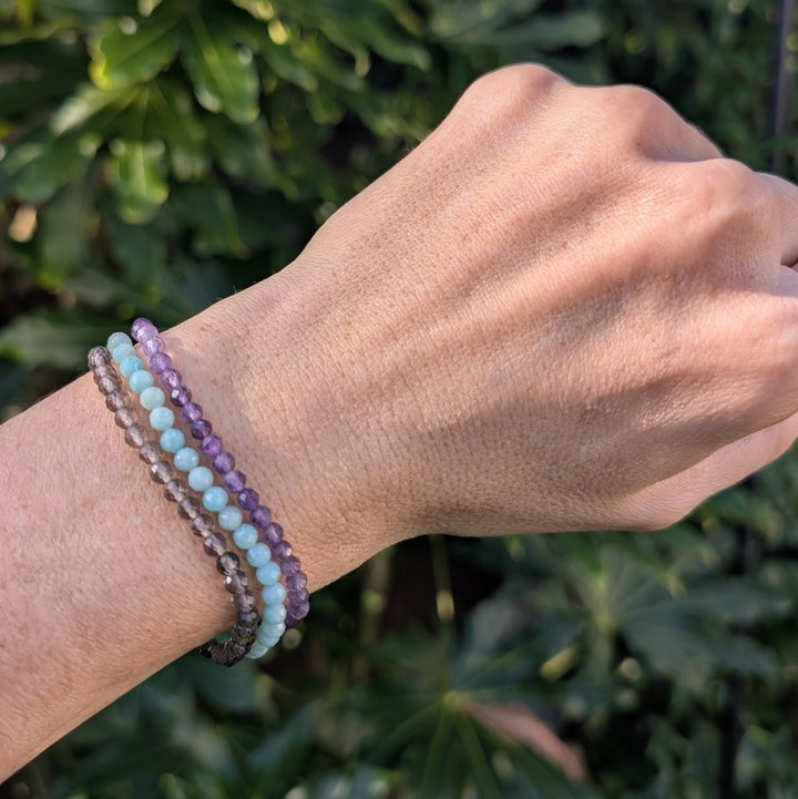 Virgo gemstone bracelet set comprising amazonite, smoky quartz and amethyst gemstone bracelets. 