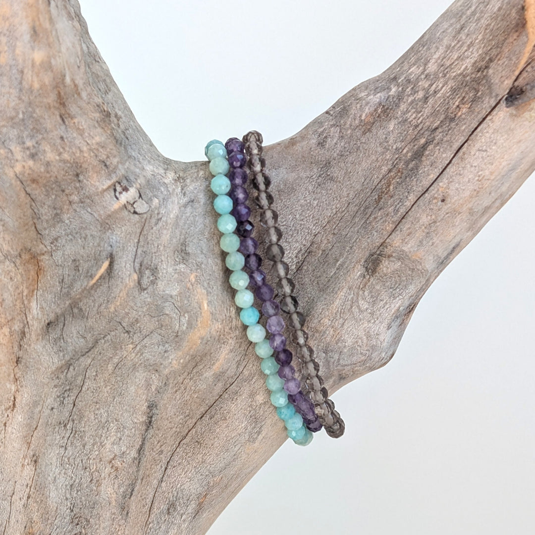 Virgo gemstone bracelet set comprising amazonite, smoky quartz and amethyst gemstone bracelets. 