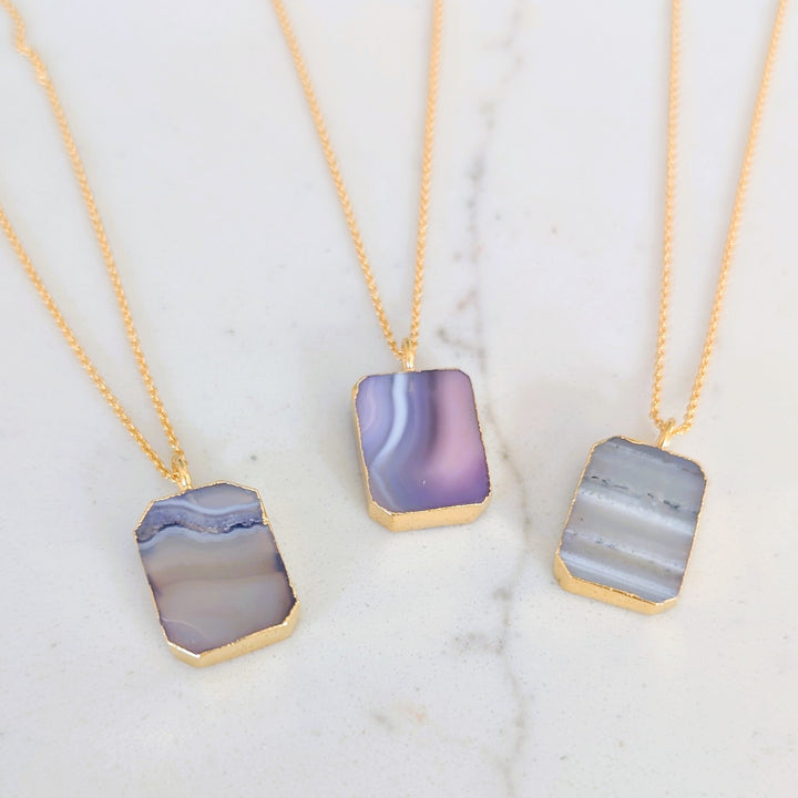Three gold amethyst strata rectangular pendant necklaces 