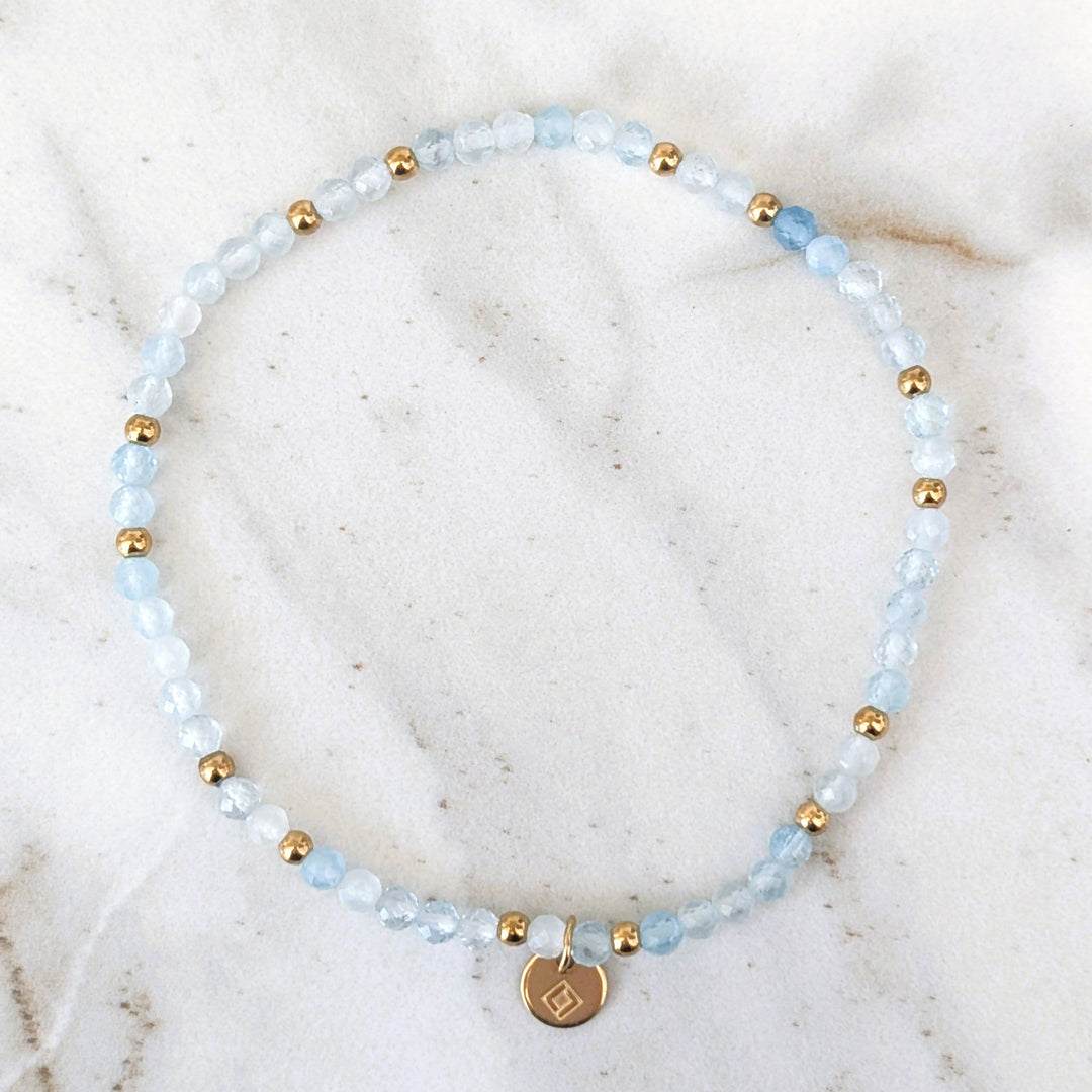 aquamarine gemstone and gold bead bracelet
