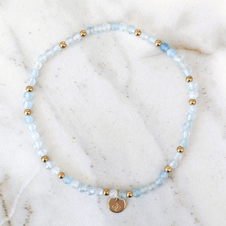 aquamarine gemstone and gold bead bracelet