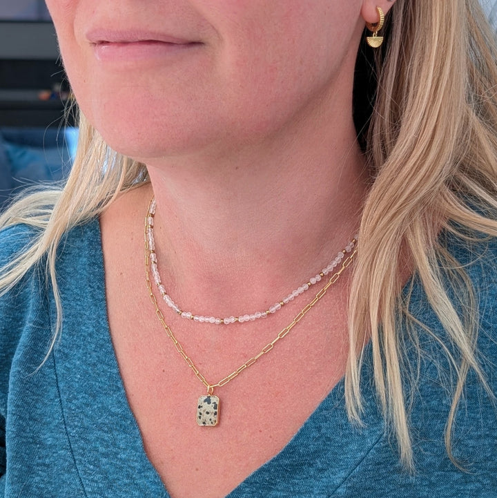 clear quartz gemstone and gold bead necklace 
