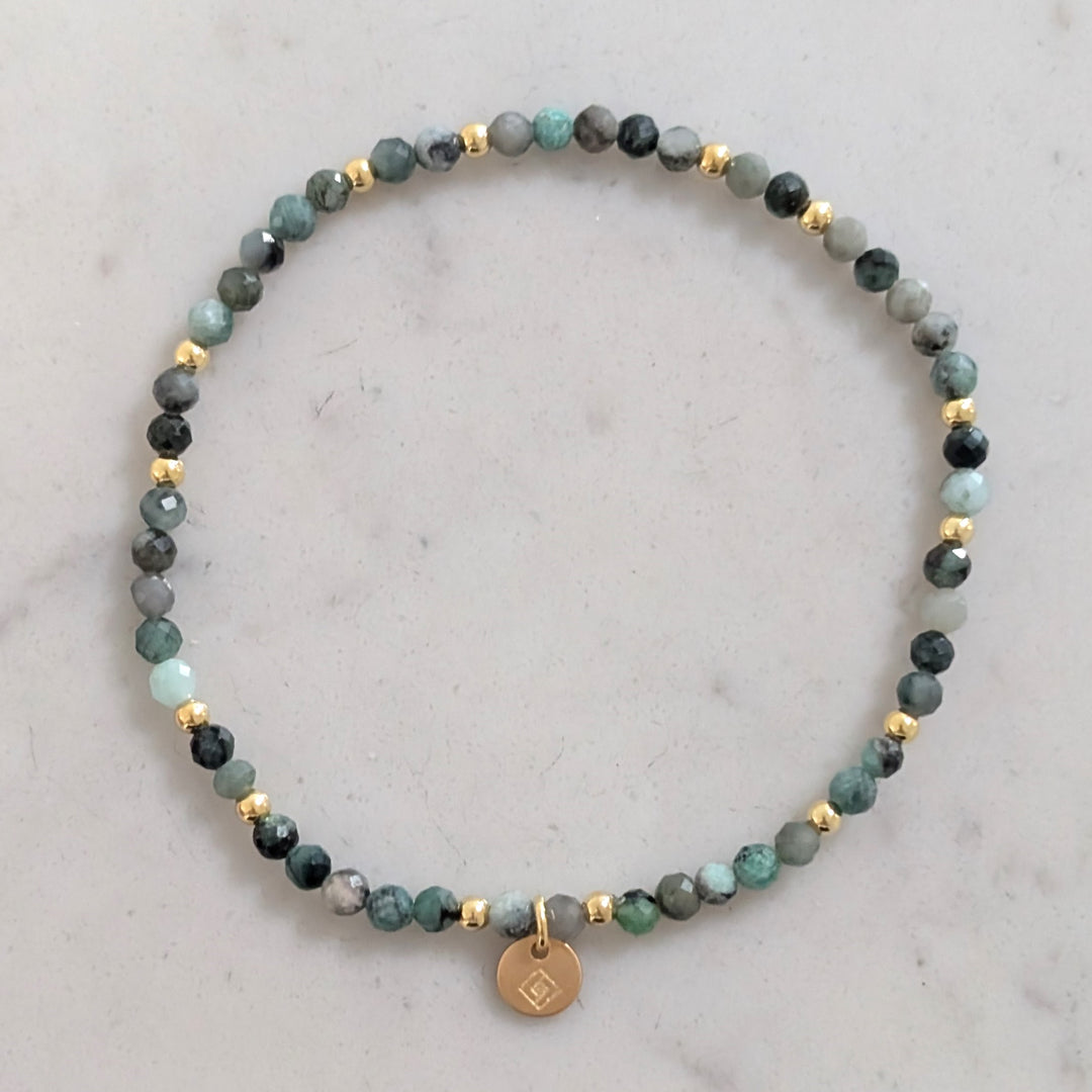 emerald gemstone and gold bead bracelet 