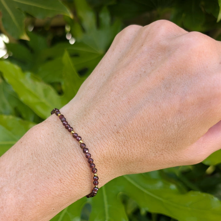 garnet January birthstone gemstone and gold bead bracelet 