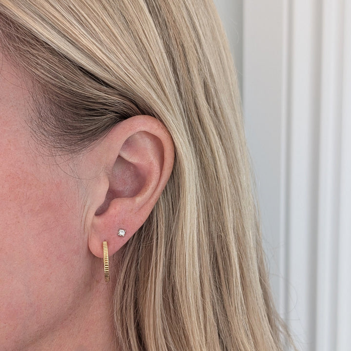 pair of gold textured hoop earrings