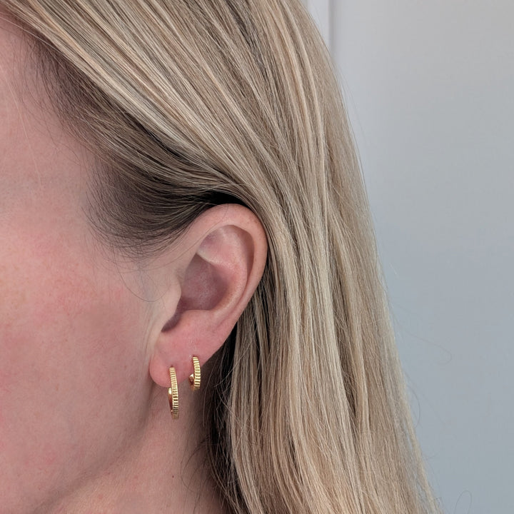 pair of gold textured hoop earrings