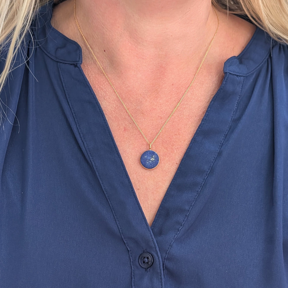 Gold framed lapis lazuli circular pendant necklace 