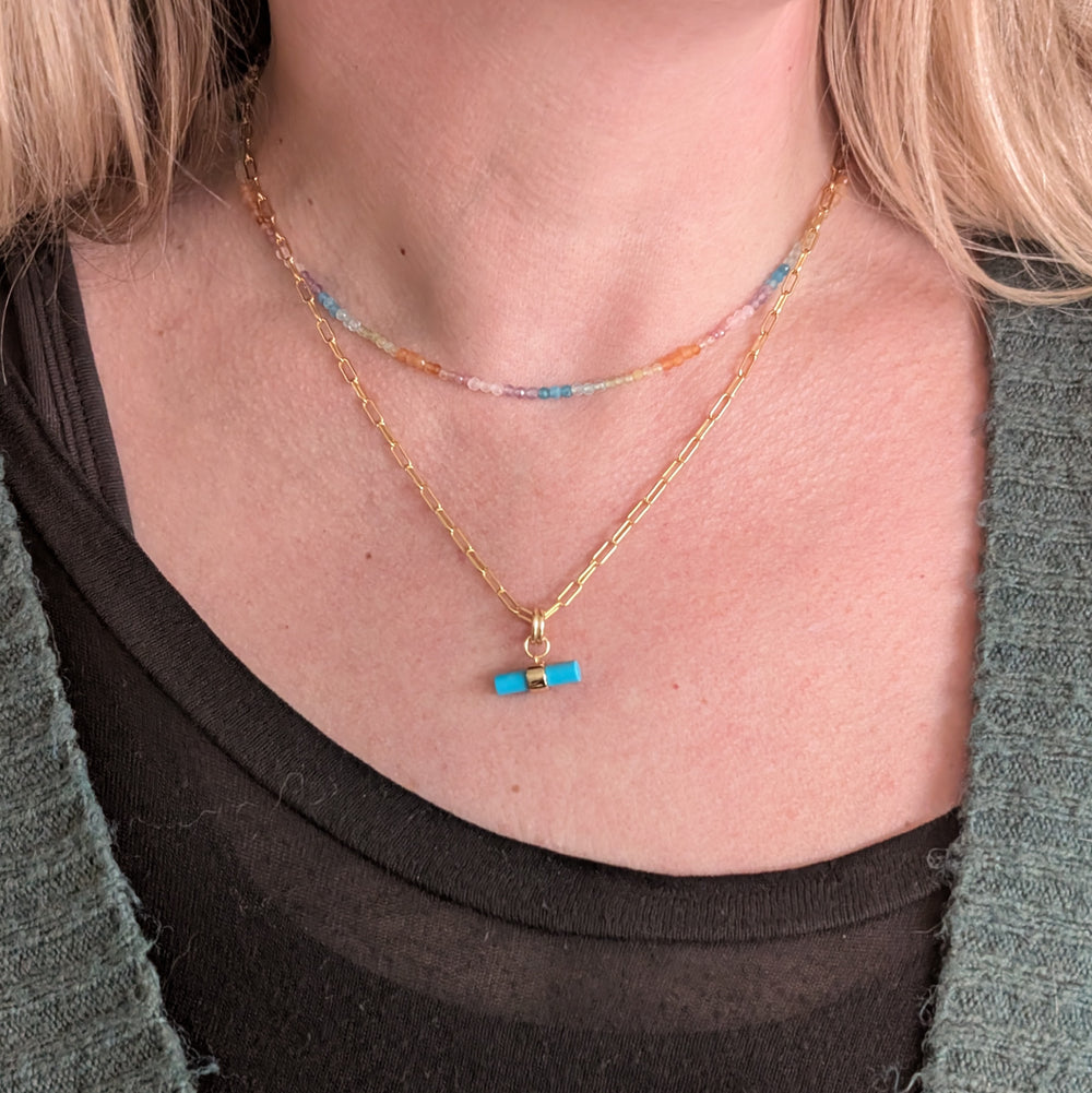Good Vibes rainbow gemstone bead necklace layered with a turquoise gold t-bar necklace