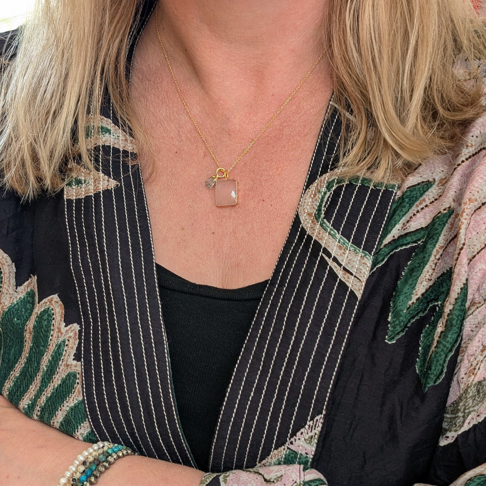 gold chain necklace with rose quartz rectangular pendant and aquamarine charm 