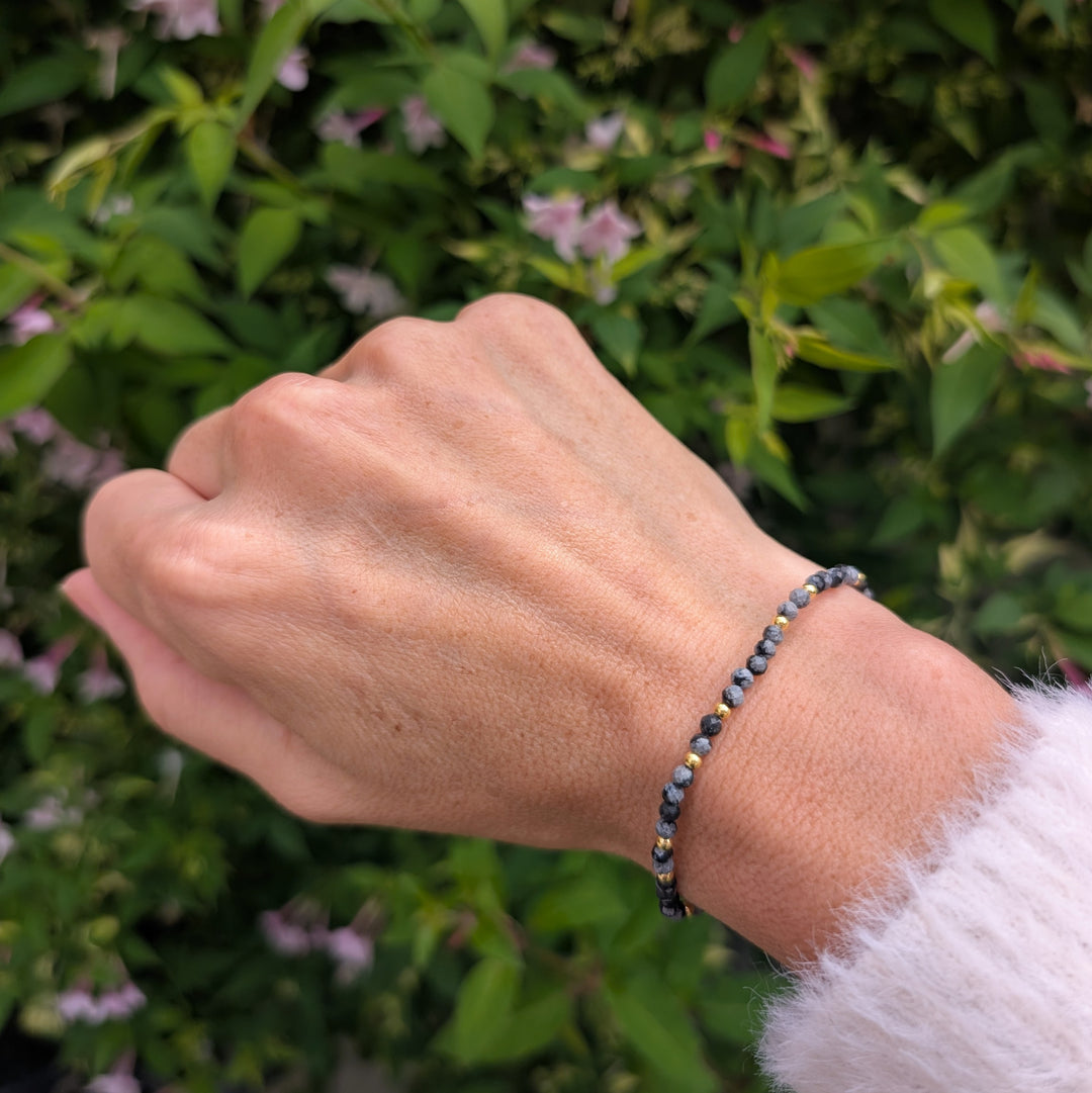 snowflake obsidian gemstone and gold bead bracelet 