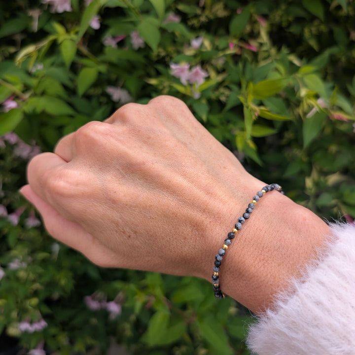 snowflake obsidian gemstone and gold bead bracelet 