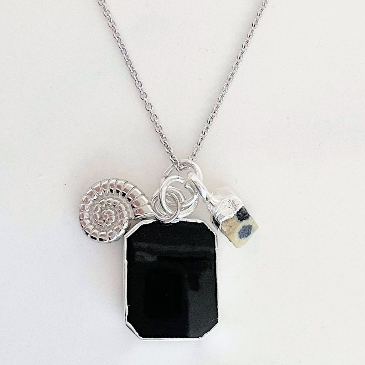 Sterling silver black onyx, dalmatian jasper and ammonite charm necklace