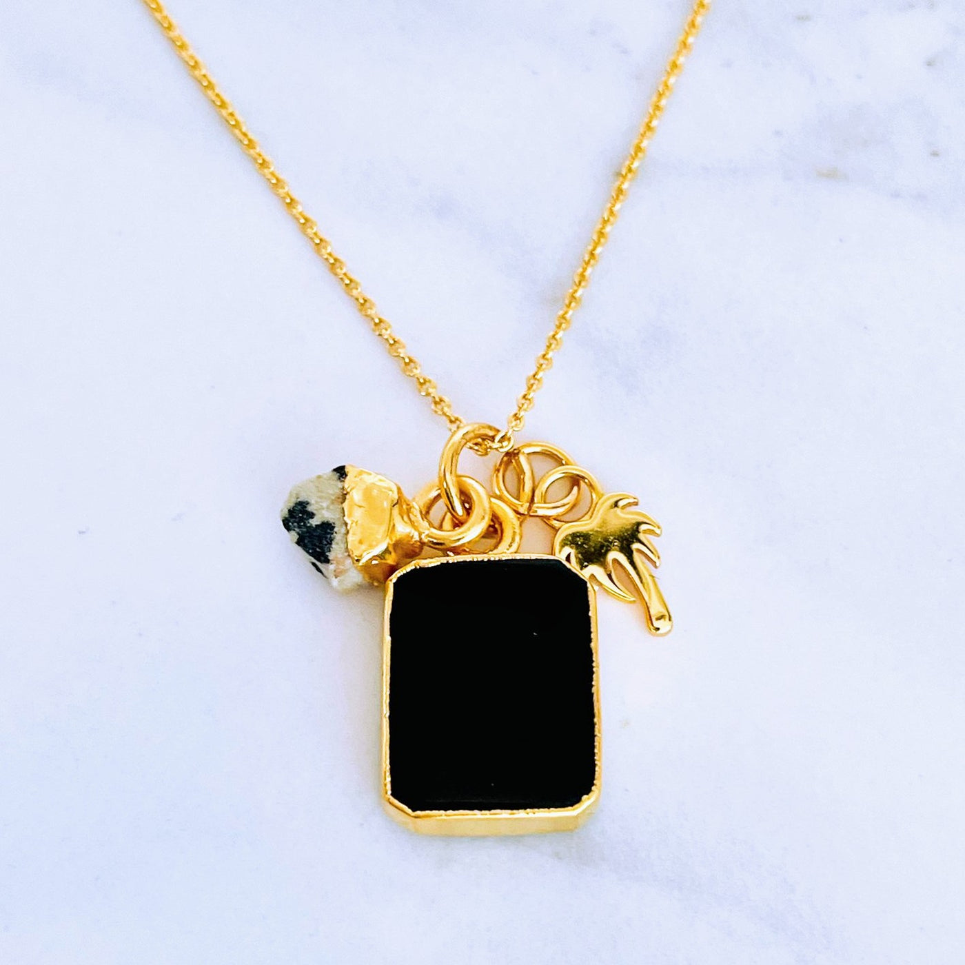 Gold plated black onyx, dalmatian jasper and palm tree charm pendant necklace