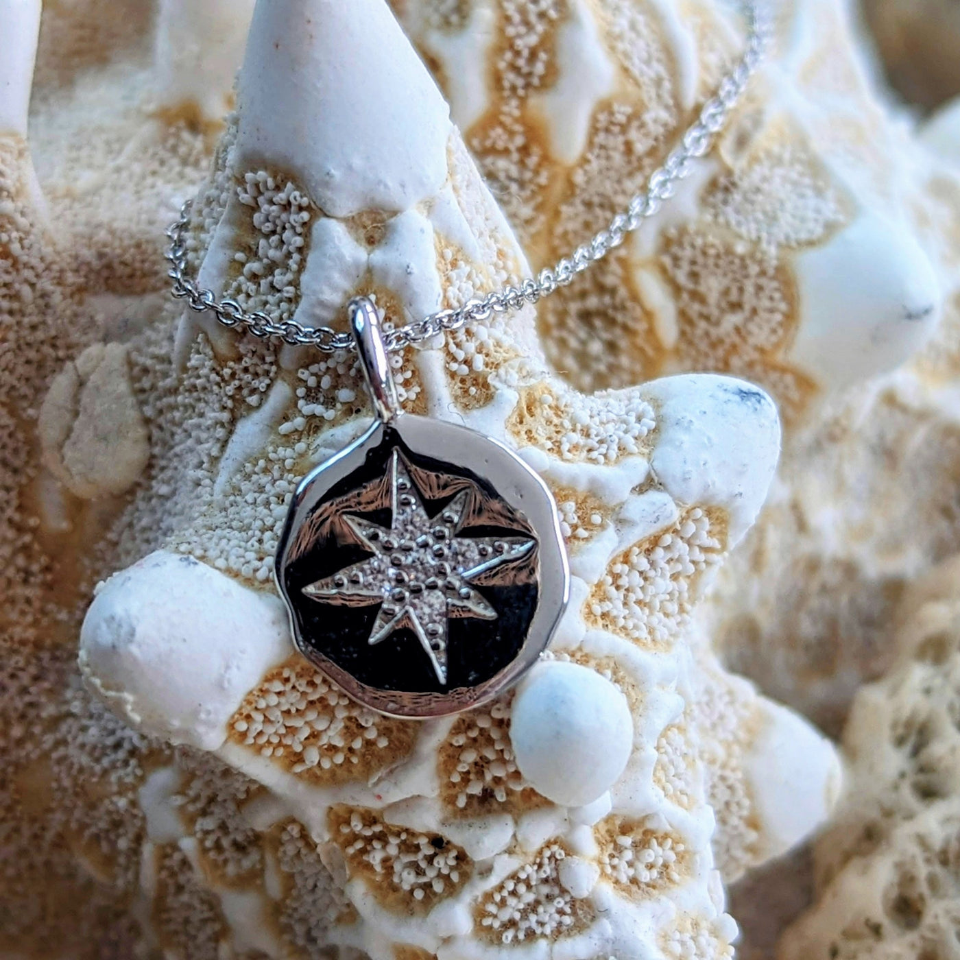 Sterling silver starburst disc pendant necklace