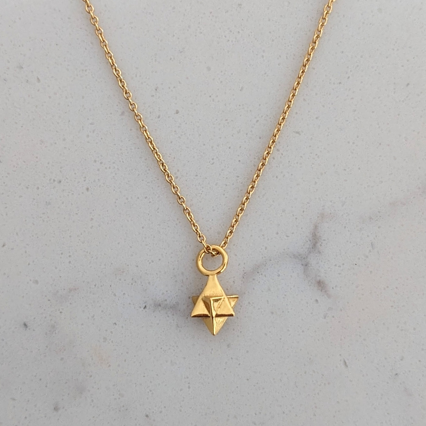Gold plated tetrahedron necklace